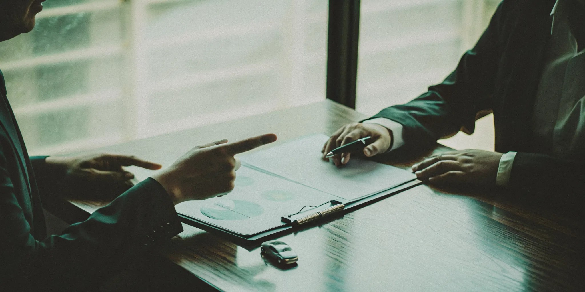 Attorney and client discussing car accident settlement options.